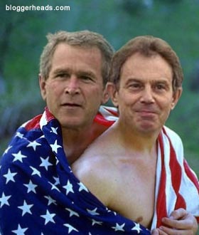 Tony Blair and George Bush cuddle under a flag